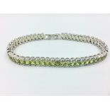 Silver & peridot line bracelet