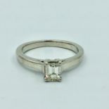 Platinum & diamond single stone ring, central emerald cut diamond in 4 claw setting 0.44ct 4.4g size