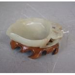 Carved jade Chinese brush washer as a lotus leaf on carved hardwood stem