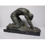 Bronze figure of a kneeling man on black marble base 67cm h