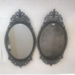 Pair of mahogany Edwardian oval fret work wall mirrors, the frames enhanced with harebells & acorns