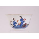 C19th Chinese famille rose sgraffito bowl, painted with figures in a riverside landscape scene,