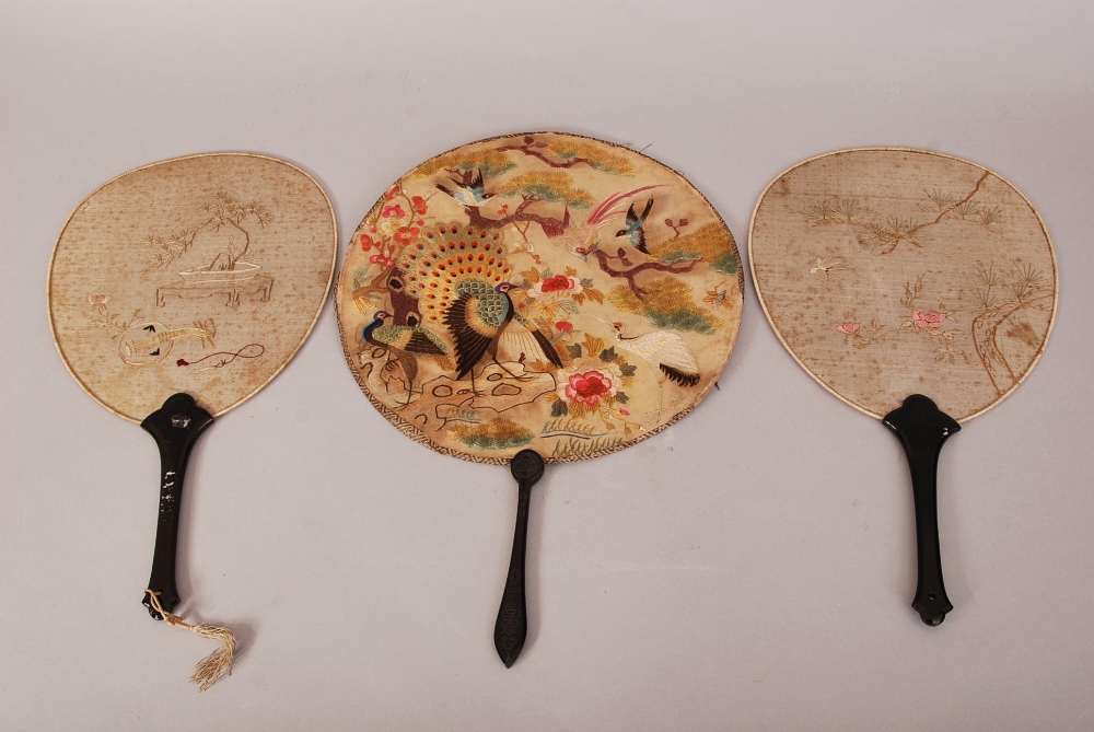 C19th Chinese silk circular fan, woven to each side with peacocks and blossoms, mounted with a