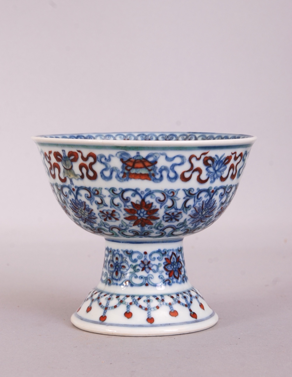 C18th Chinese Doucai stem bowl, painted to the exterior with scrolling lotus flowers and the Eight