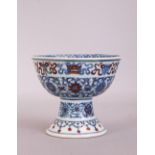C18th Chinese Doucai stem bowl, painted to the exterior with scrolling lotus flowers and the Eight