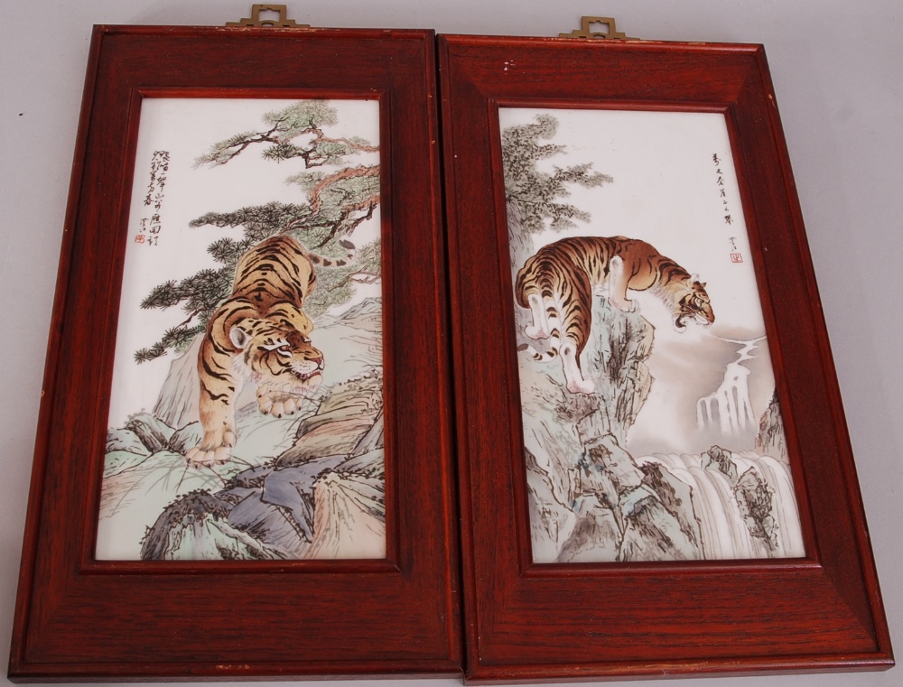 Pair of C20th Chinese famille rose 'tiger' panels, with poetic inscriptions and followed by a red