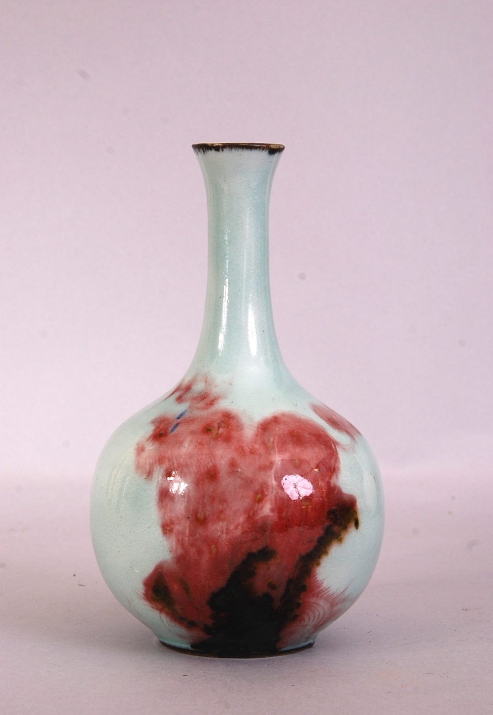 18th Chinese copper-red and underglaze blue-decorated celadon-glazed bottle vase, 20cm high.
