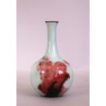 18th Chinese copper-red and underglaze blue-decorated celadon-glazed bottle vase, 20cm high.