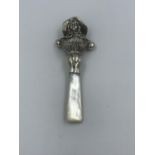 Silver babies rattle with mother of pearl handle