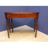 Mahogany and inlaid fold over tea table on four column and circular banded legs, 91cmW