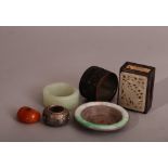 A group of Chinese mixed lot to include a carved coconut shell napkin ring, a jade napkin ring, a