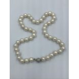 Cultured pearl necklace with diamond ball clasp