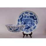 Large Chinese blue and white plate painted with four fish swimming amongst reeds and aquatic plants,