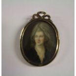 Yellow metal cased miniature of a regency lady