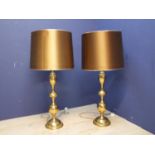 Decorative, oversized pair of brass lamps with gold coloured lampshades, 112cmH