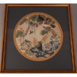 C19th Chinese silk embroidered circular panel, woven with birds, rockwork and flowering plants, 30cm