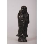 C18th/19th Chinese hardstone figure of Luohan, shown standing with his head turned slightly to the