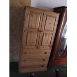 Small pine wardrobe, the upper cupboard with hanging rail, above 3 drawers to base, 178x86cm, & a