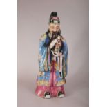 Large C18th/19th Chinese famille rose figure of a dignitary, holding a child and wearing long