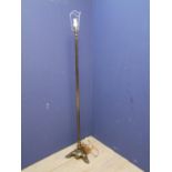 Brass column standard lamp, on paw feet
