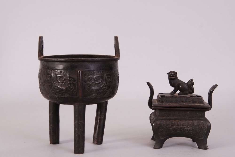 C19th Chinese bronze ritual tripod vessel, Ding, raised on three columnar supports and cast to the