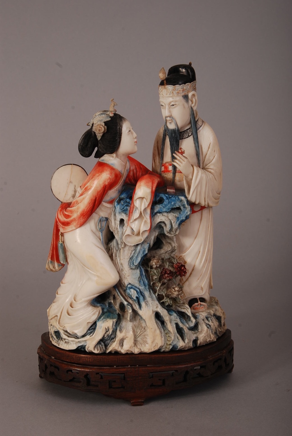 C19th Chinese stained ivory figure group of a court lady and an officer, 26.5cm high, silver-