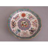 Chinese famille rose octagonal plate, painted with the Eight Buddhist emblems to the interior, and