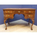 Writing desk with 1 central drawer and 4 side-drawers with brass handles, and cabriole legs 106cmW