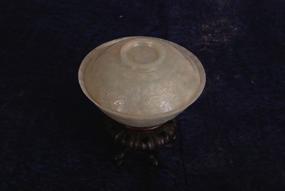 C18th/19th Chinese jade bowl and cover, carved with flower branches set between two key-fret