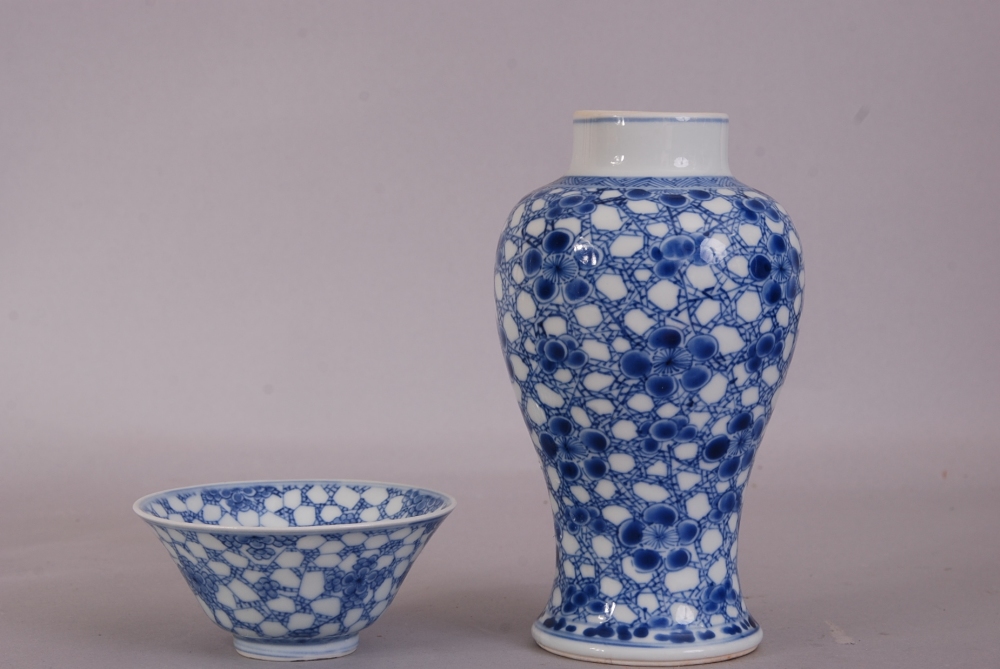 Chinese blue and white baluster vase, painted with prunus on a cracked-ice ground, Kangxi, 17cm - Image 2 of 4