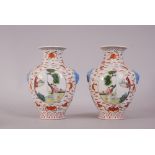 Pair of C19th Chinese famille rose vases, flanked by elephant-head twin handles, painted with panels
