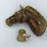 2 Horse brooches on 18ct gold example & together with a large unmarked yellow metal & enamel horse