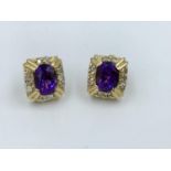 Pair of 14ct yellow gold amethyst & diamond earrings