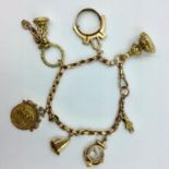 9ct Rose gold chain link bracelet with 6 9ct charms & a bezel mounted 1912 half sovereign