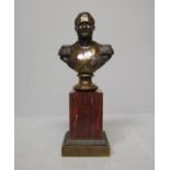 Bronze statuette of Napoleon 1/2 length on red marble column to stepped bronze base