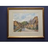 Cotswold village scene with cottage