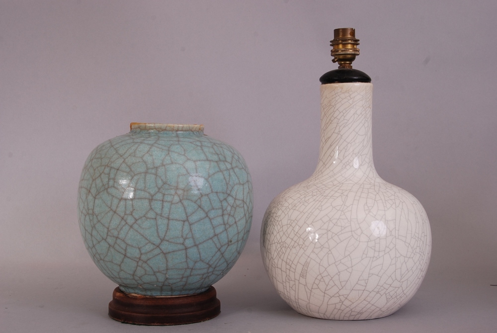 C19th Chinese pale green crackle-glazed jar, 21.5cm high, wood stand; together with a white