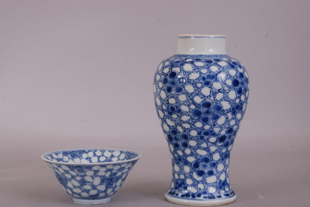 Chinese blue and white baluster vase, painted with prunus on a cracked-ice ground, Kangxi, 17cm