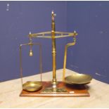 Set of brass hanging scales with weights, makers mark to brass arm, Bartlet & Sons, Bristol