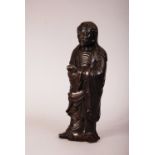 Chinese silver-inlaid bronze figure of Damo, modelled standing barefoot, wearing loose robes