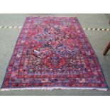 Brightly coloured Afghan wool rug in deep red & blues 235x160cm