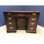 C19th oak knee hole desk of 7 drawers, brass handles, 104cmW