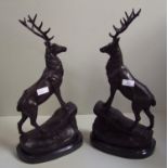 Pair of cast bronze stag on marble bases