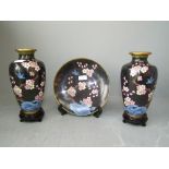 Pair of C20th black choisonne enamel vases 23cm H & matching plate decorated with flowering prunus &