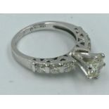 18ct white gold diamond ring the central stone of 1.3cts with diamond shoulders