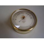 Circular brass cased barometer by Negretti & Zambra