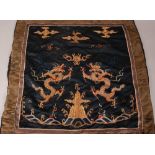 C17th Chinese silk embroidered panel, woven with two dragons chasing a flaming pearl above