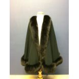 Ladies' very smart luxurious black & fur wrap around cape, with French designer label