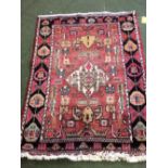 Persian rug with blue centre & black & red borders, 200x140cm