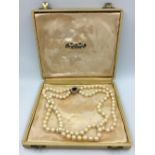 2 string pearl necklace with amethyst & pearl clasp stamped DHJ marked 375 in original cased box